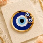 Evil eye plate including roli chawal bottle
